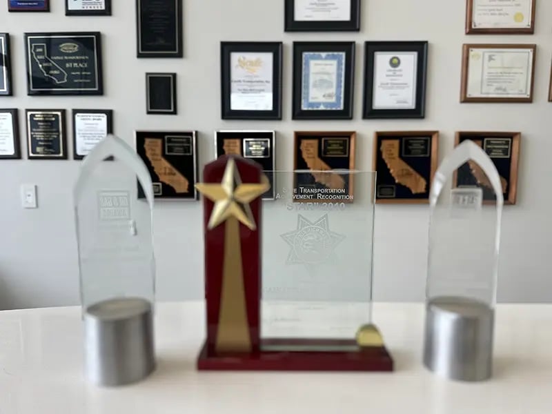 Gazelle Awards on the wall and on a table.