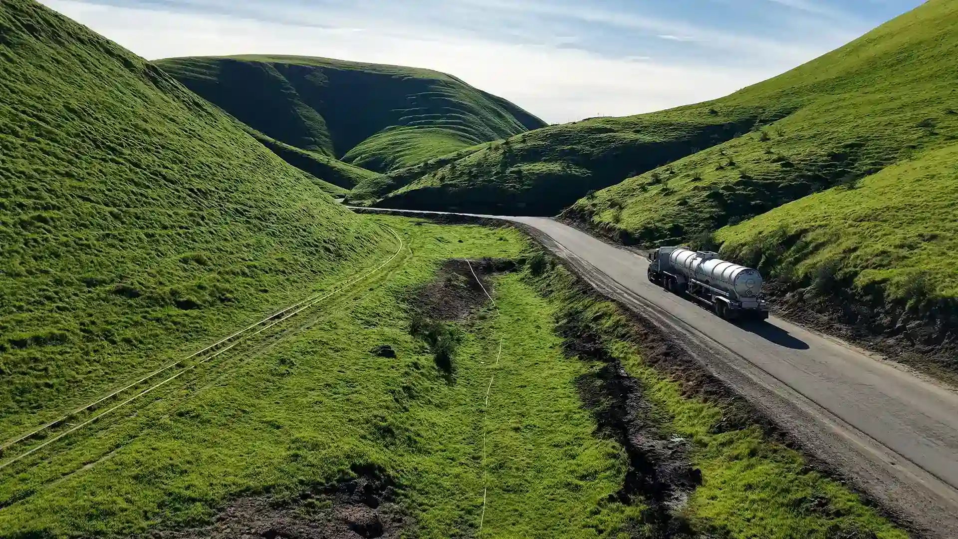 Gallery Tanker truck on the road on a hillside.